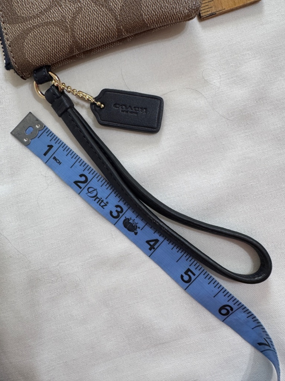Coach Wristlet Tan/Brown monogram with teal and blue stripes and navy blue strap - Picture 6 of 7